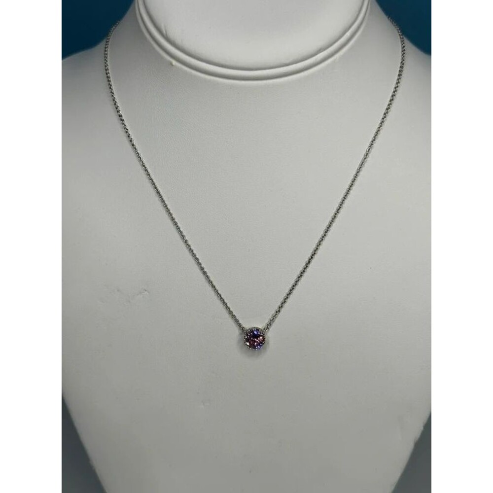 Silver tone necklace with pink stone pendant